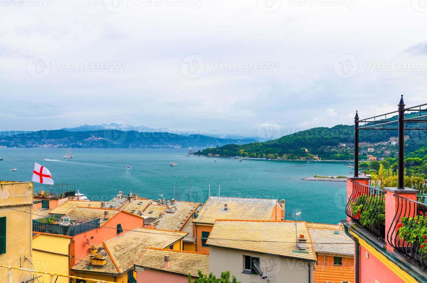 Top aerial view of Gulf of Spezia turquoise water, roofs of buildings in Portovenere photo