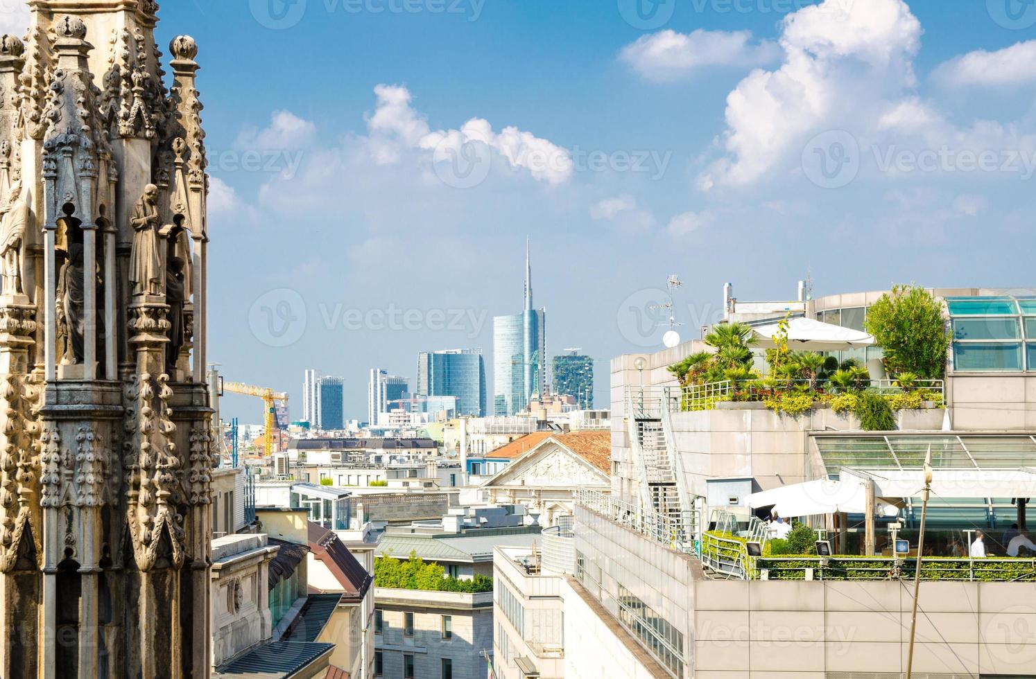 White marble statues on roof of Duomo di Milano Cathedral, Italy photo