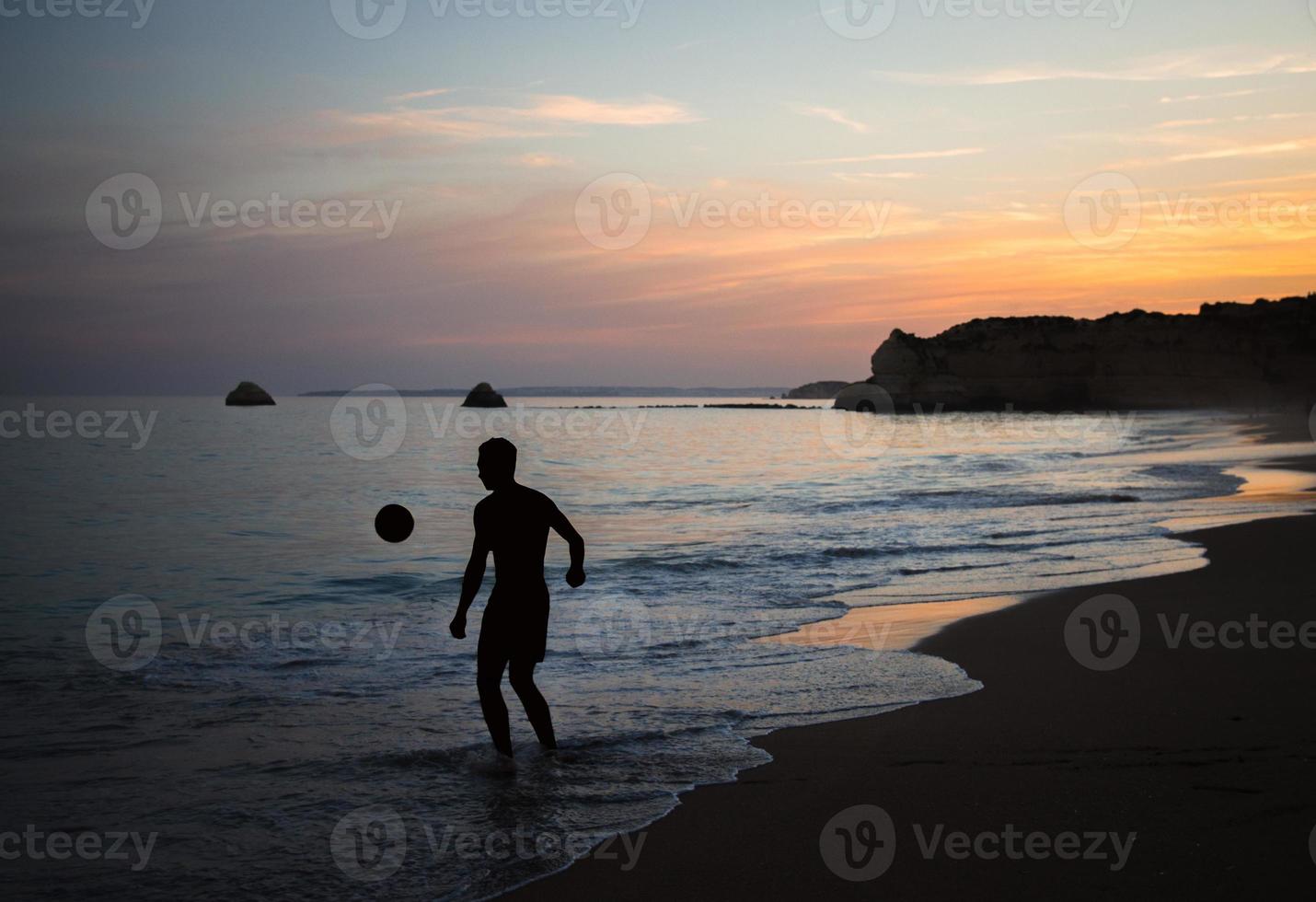 Portugal, Algarve, The best beaches of Portimao, Praia da Rocha, sunset over The Atlantic Ocean photo