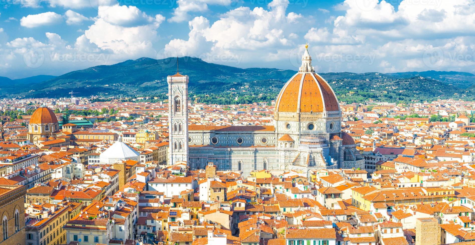 Top aerial panoramic view of Florence city with Duomo Cattedrale di Santa Maria del Fiore cathedral photo