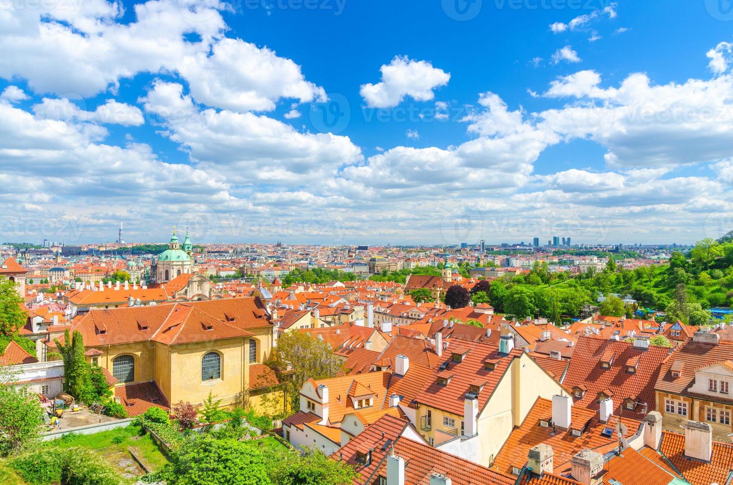 Top aerial panoramic view of Prague historical city centre with red tiled roof buildings photo