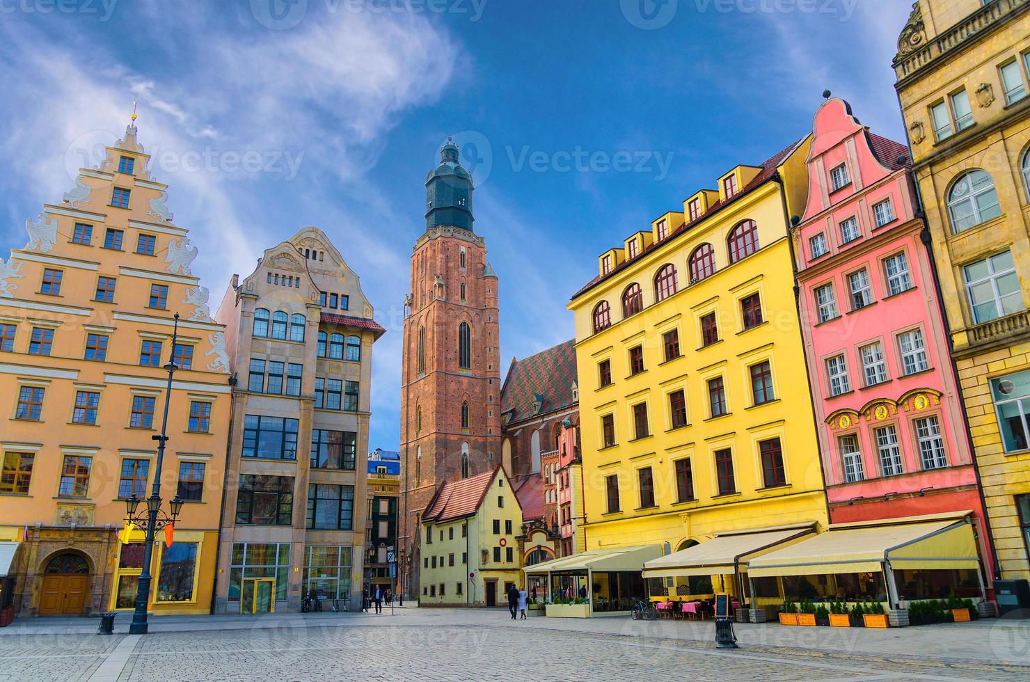 Row of colorful buildings with multicolored facade and St. Elizabeth Minor Basilica Garrison catholic Church photo