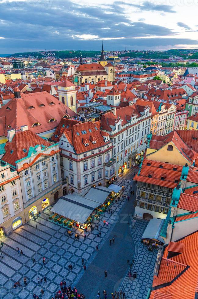 Top aerial panoramic view of Prague Old Town Stare Mesto historical city centre with red tiled roof buildings photo