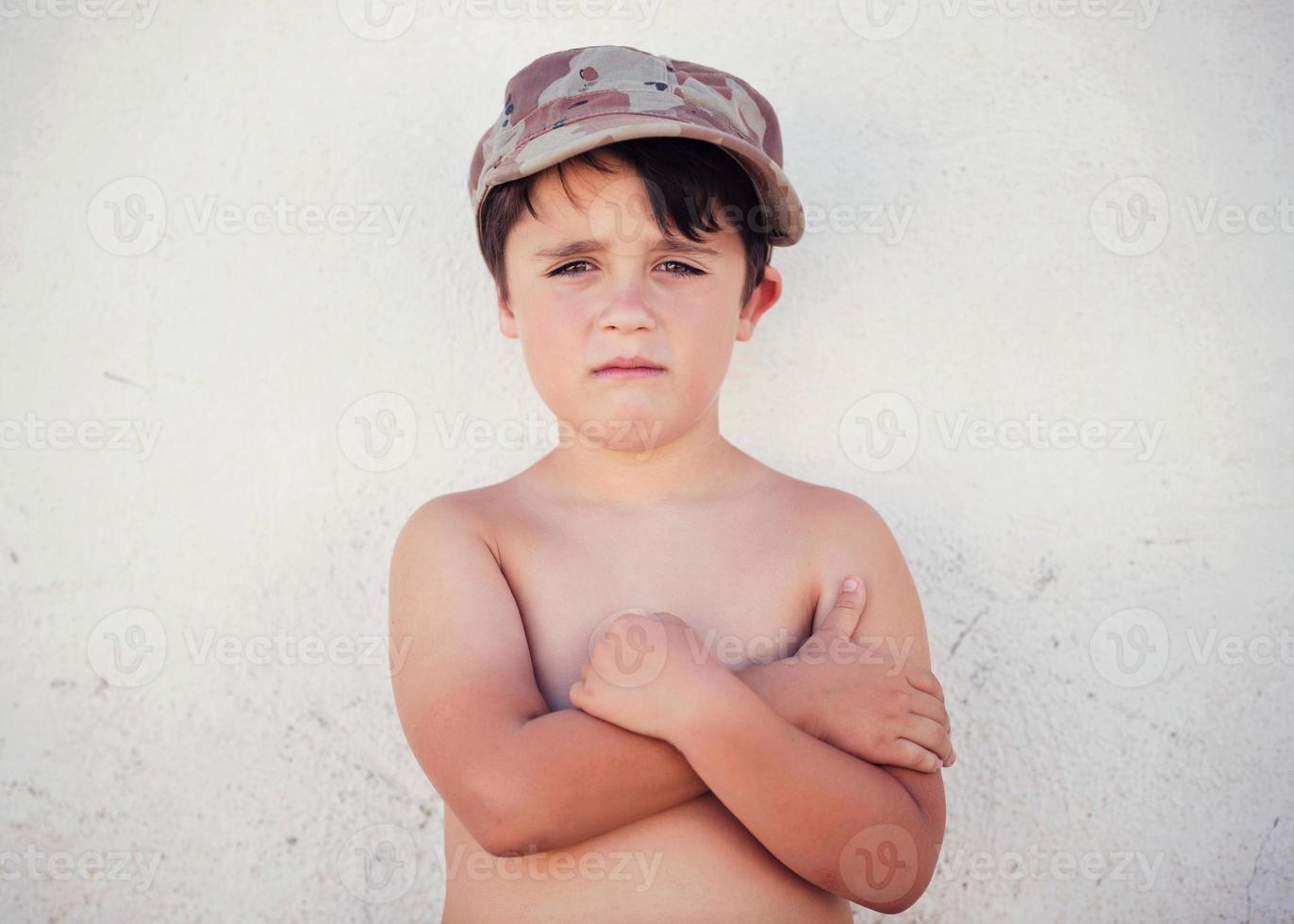 sad boy with hat photo