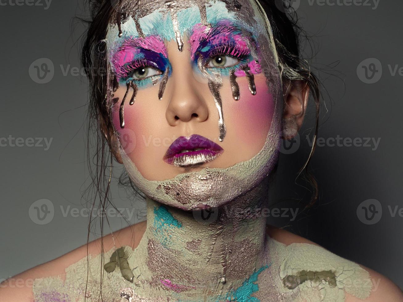 Portrait of woman with creative fashion makeup photo