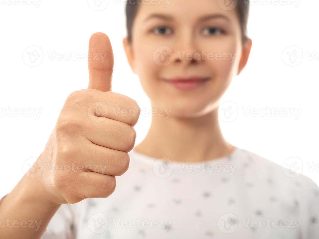 Woman showing thumb up sign photo