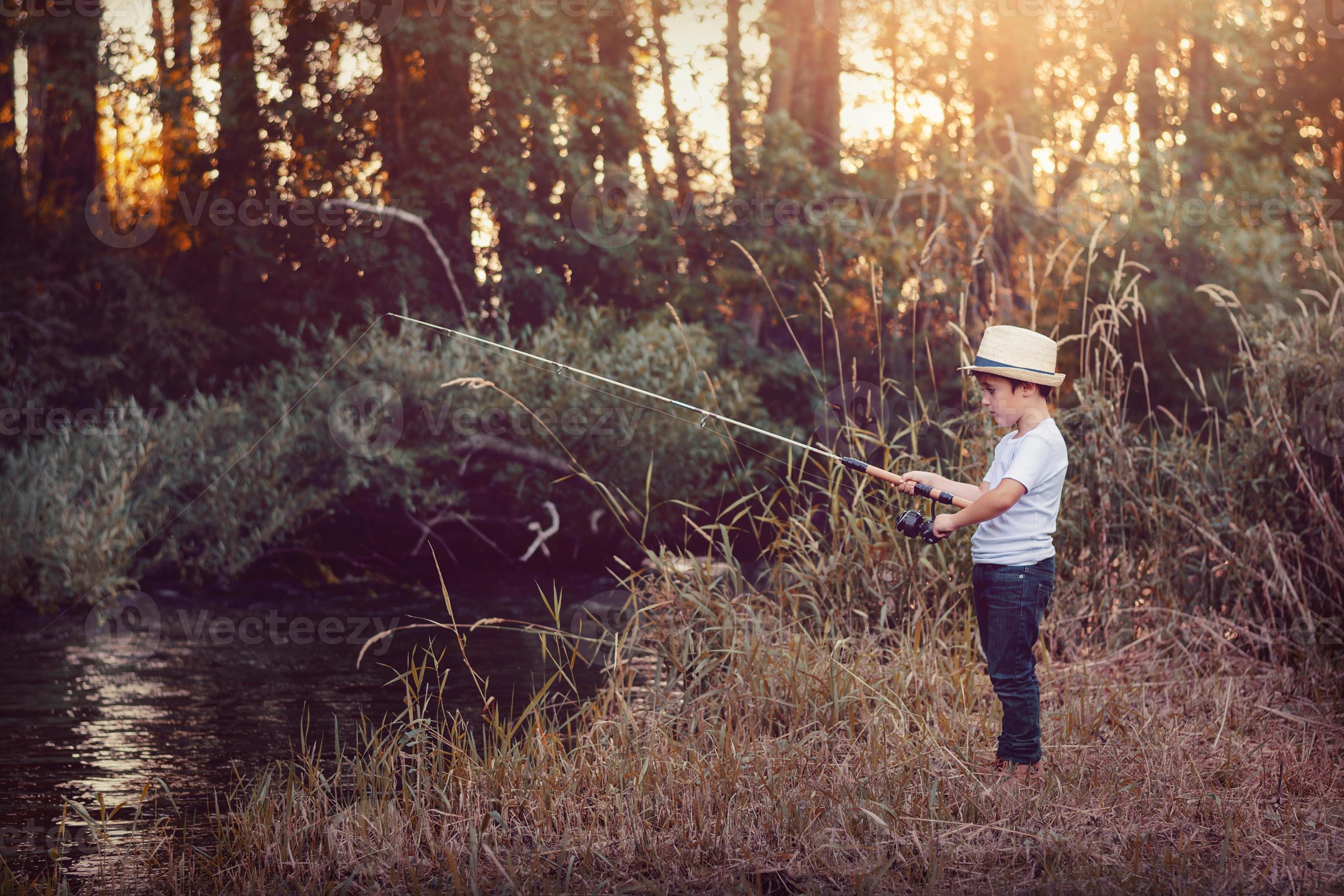 Young boy fishing 6149215 Stock Photo at Vecteezy