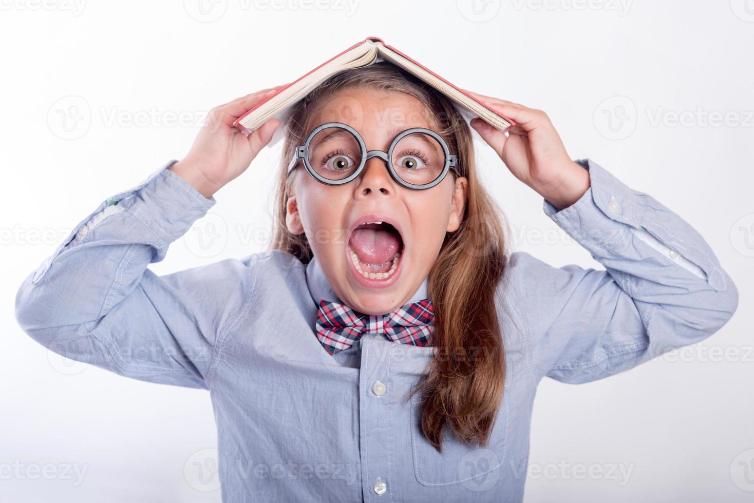 surprised girl with a book photo