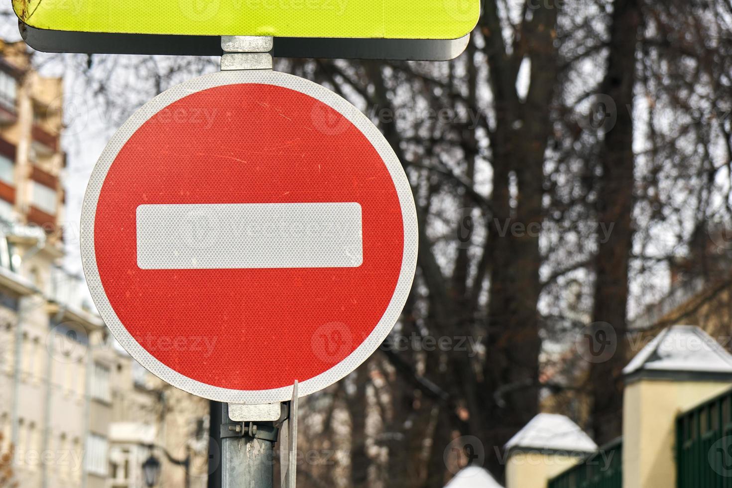 Modern red do not enter road sign with a reflecting surface in Moscow. photo