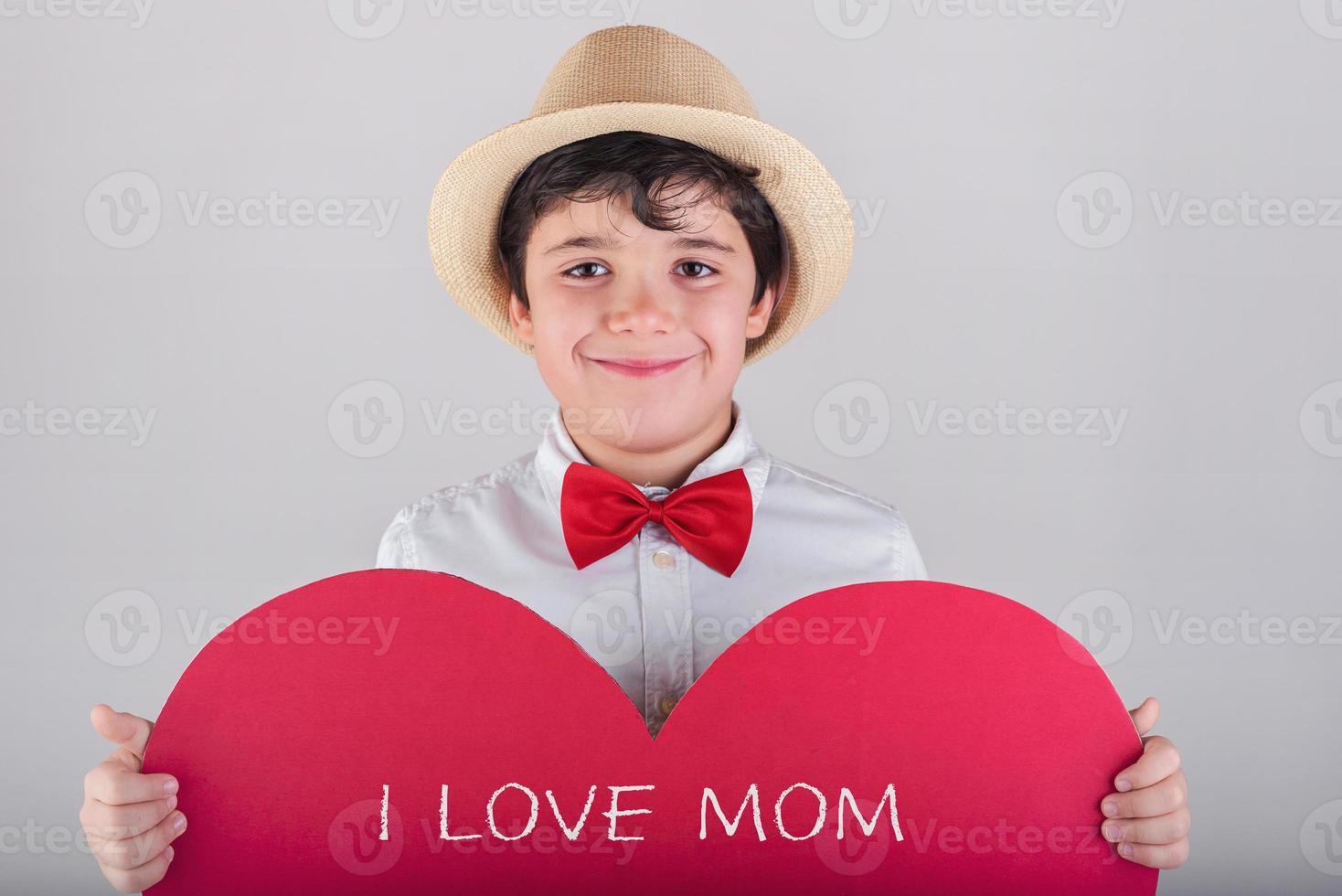 I love mom, happy child with a red heart photo