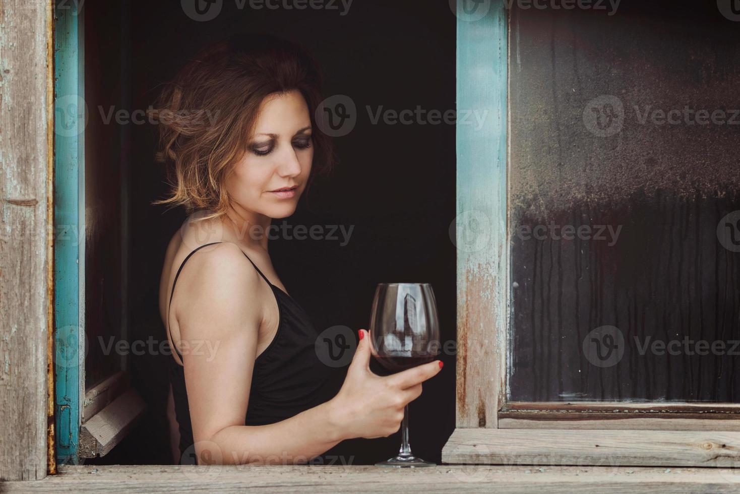 Beautiful woman with wine glass photo