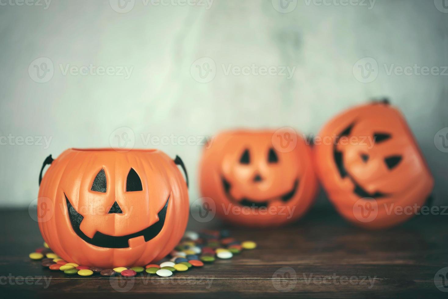 Happy Halloween. Halloween pumpkin with colorful candies photo