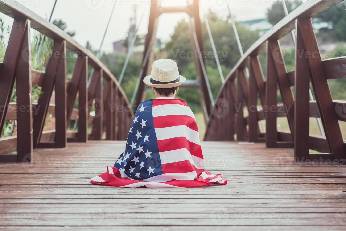 sad child with the flag of the United States photo