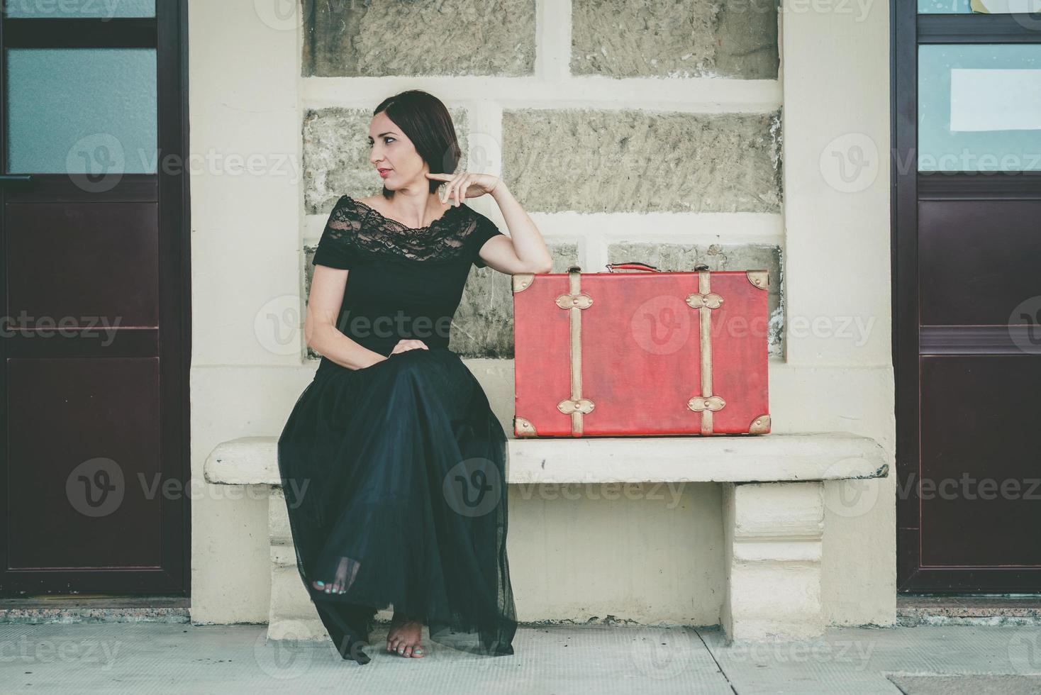 Young woman on train tracks photo