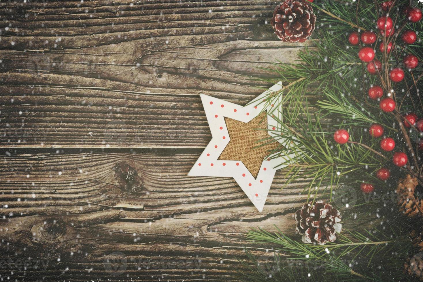 Christmas decor Over Rustic Wood Background photo