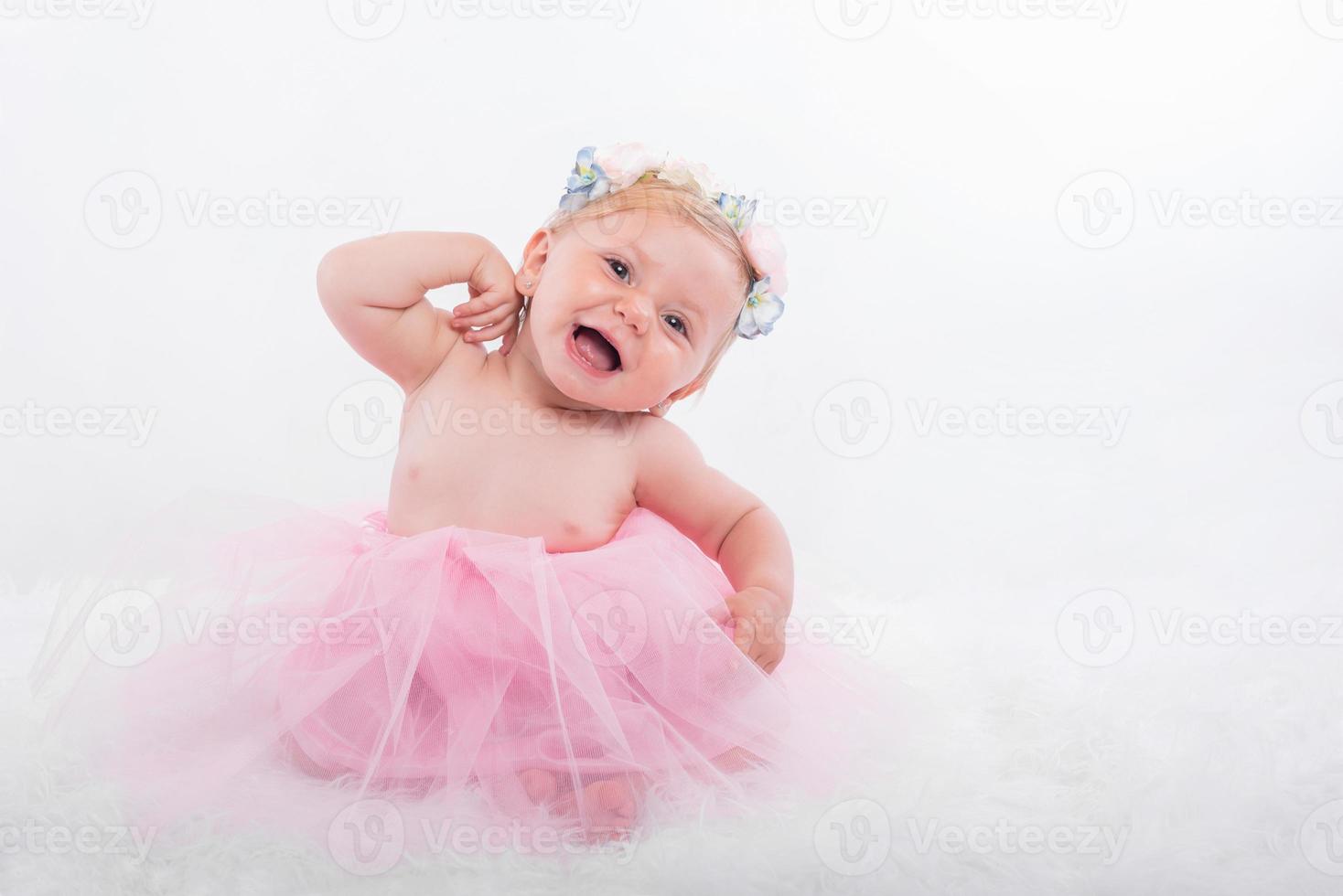 Smiling baby girl dressed as a ballerina photo