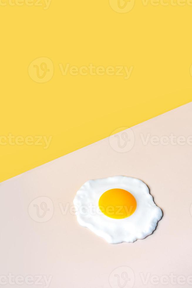 fried egg on a beige background photo