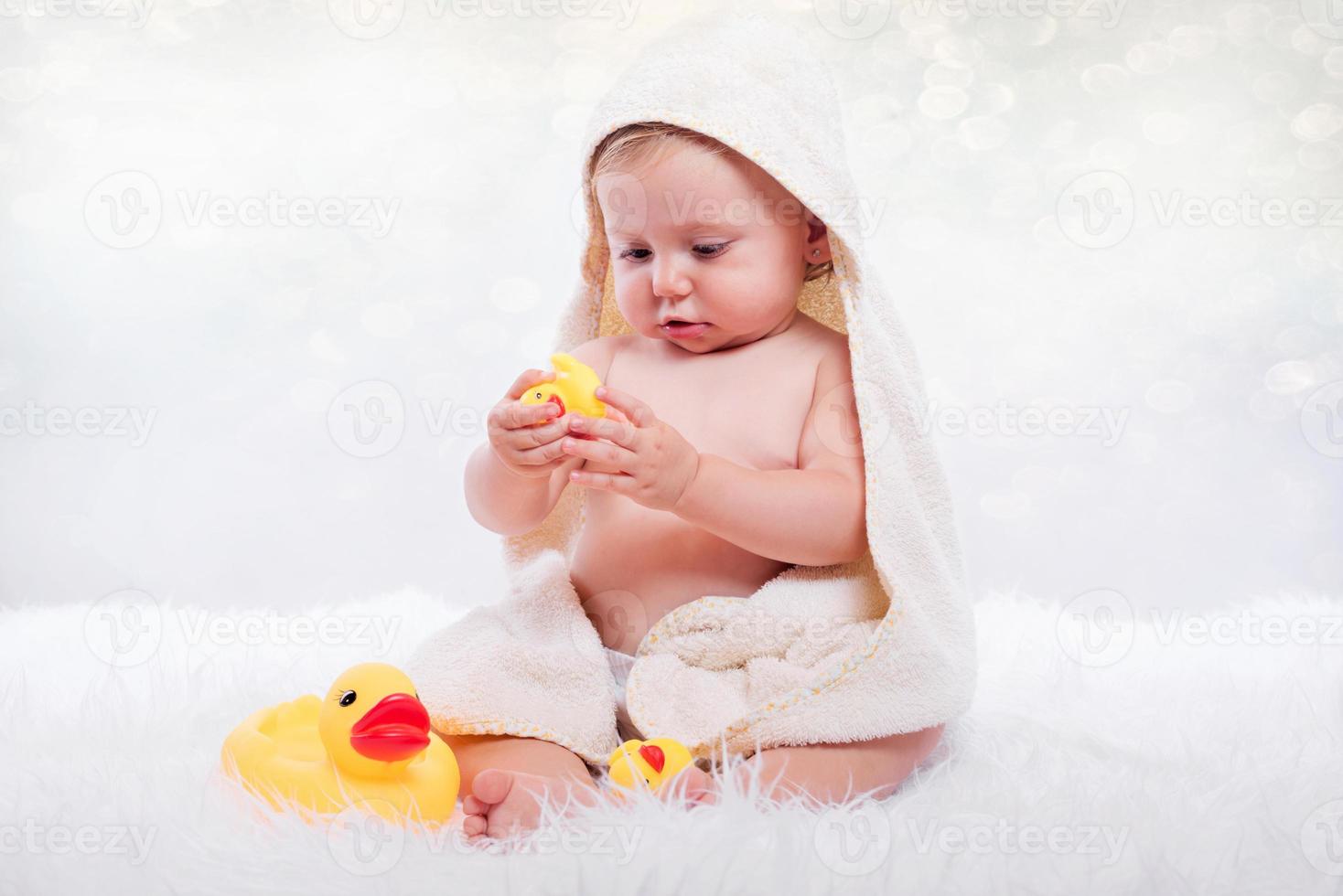 Happy baby in a towel photo