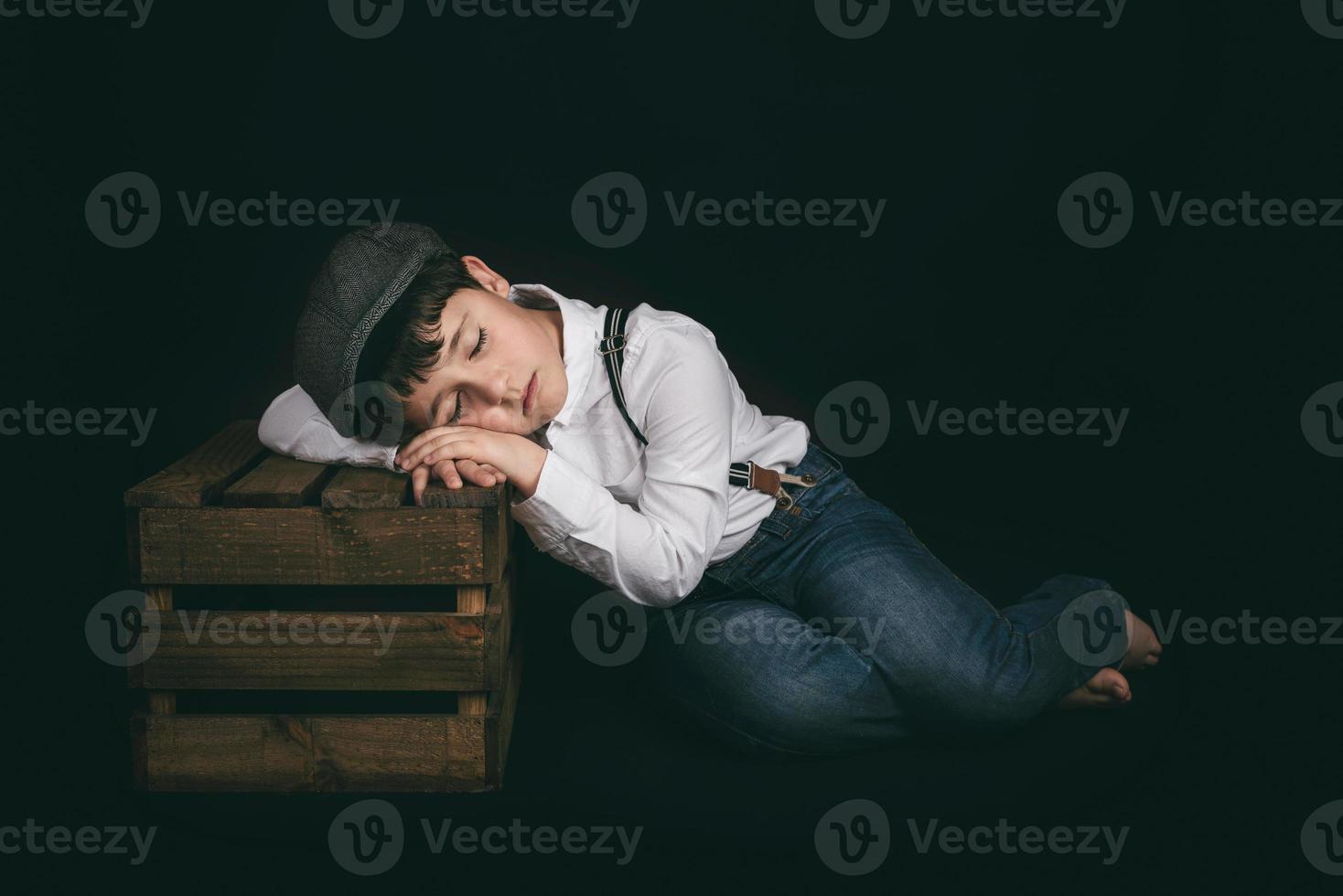 sad child with closed eyes photo