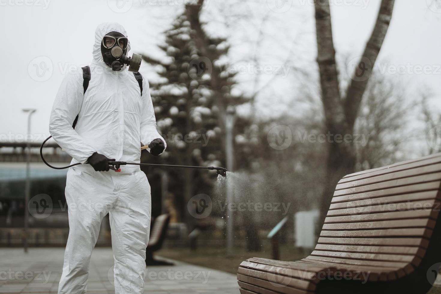 Cleaning and Disinfection at town complex amid the coronavirus epidemic Professional teams for disinfection efforts Infection prevention and control of epidemic Protective suit and mask photo