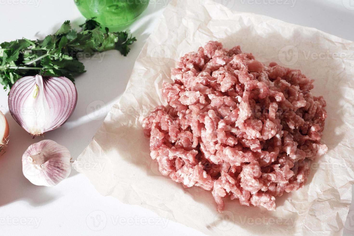 homemade minced pork on parchment paper photo