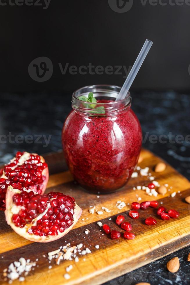 freshly prepared smoothies from banana and pomegranate. Diet, a healthy lifestyle photo