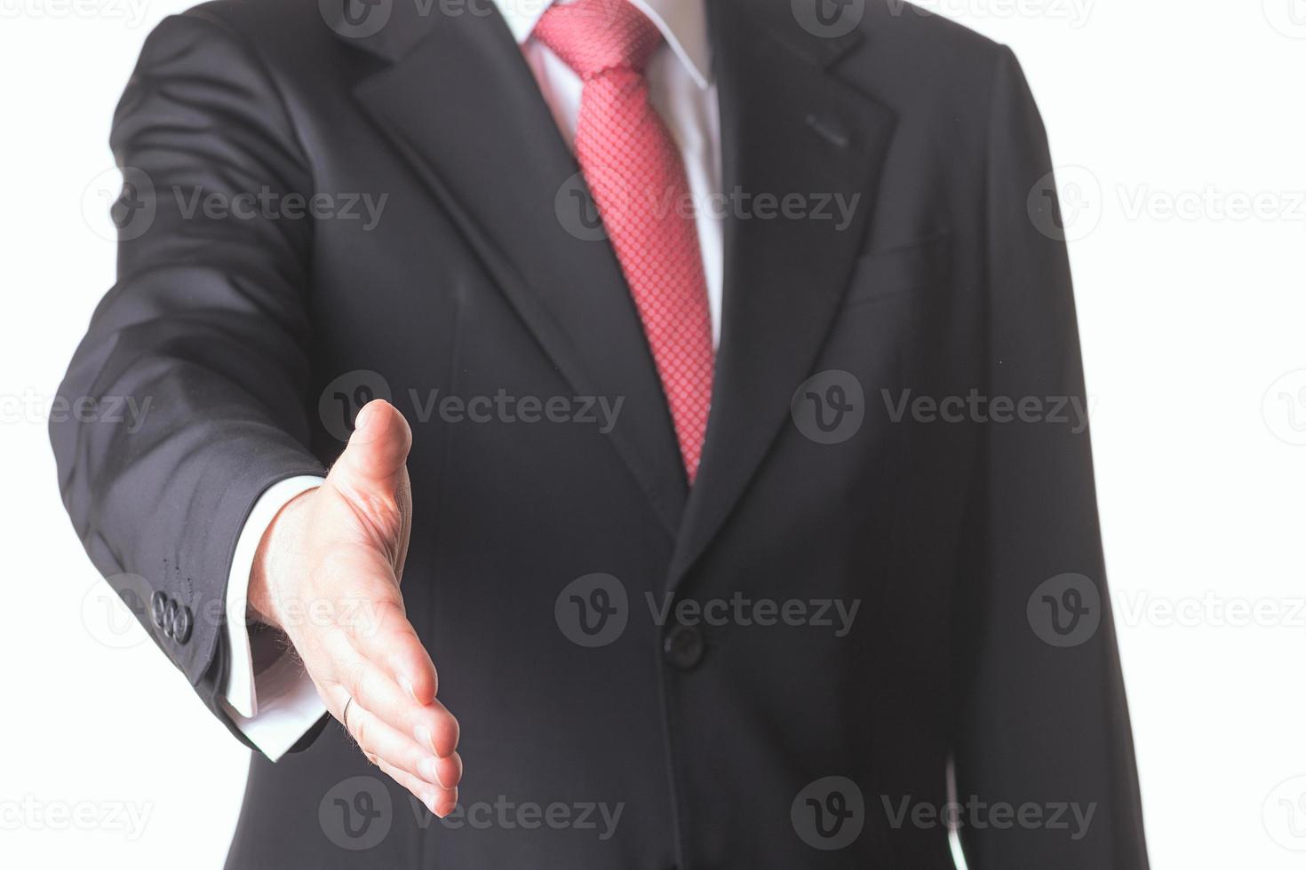 close up of business man hand extended to handshake photo