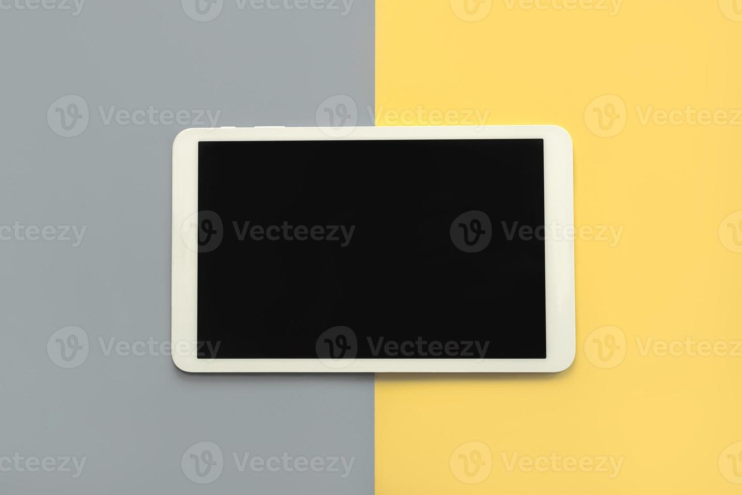 White digital tablet with black screen photo