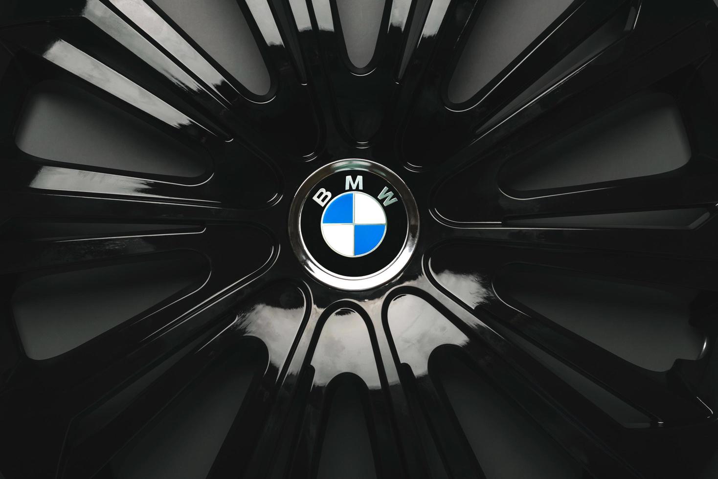 Closeup of BMW logo on car rim photo
