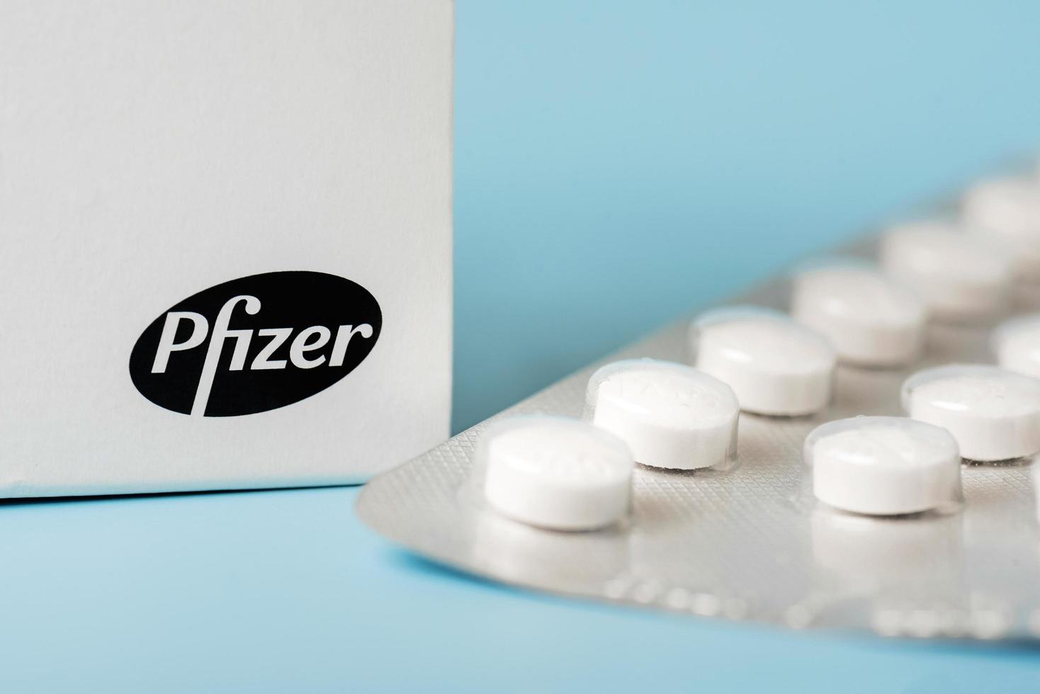 Pfizer medicine box and blister with white tablets photo