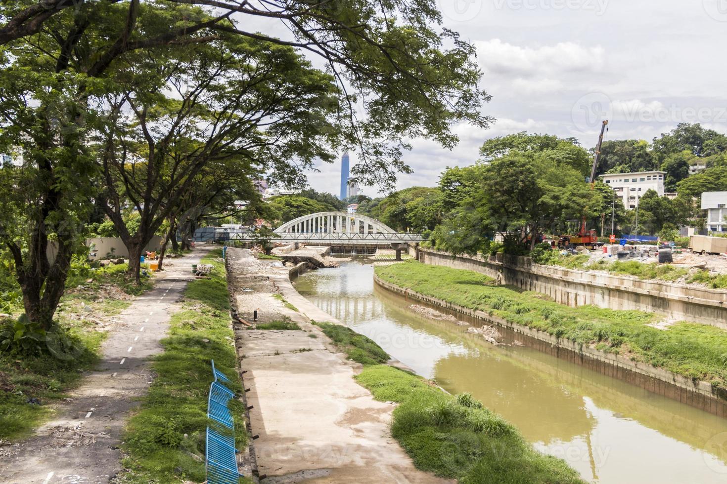 River with railway bridge, construction sites and The Exchange 106. photo