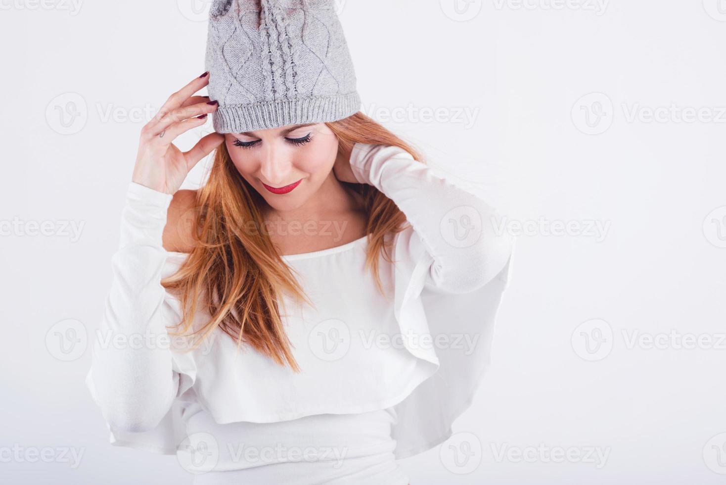 thoughtful Young woman with winter hat photo