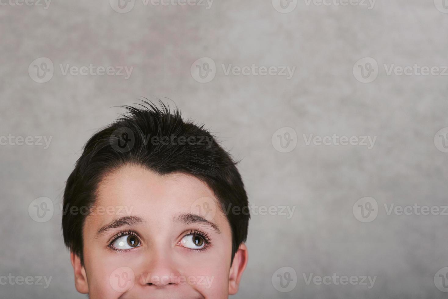 happy smiling boy looking up photo