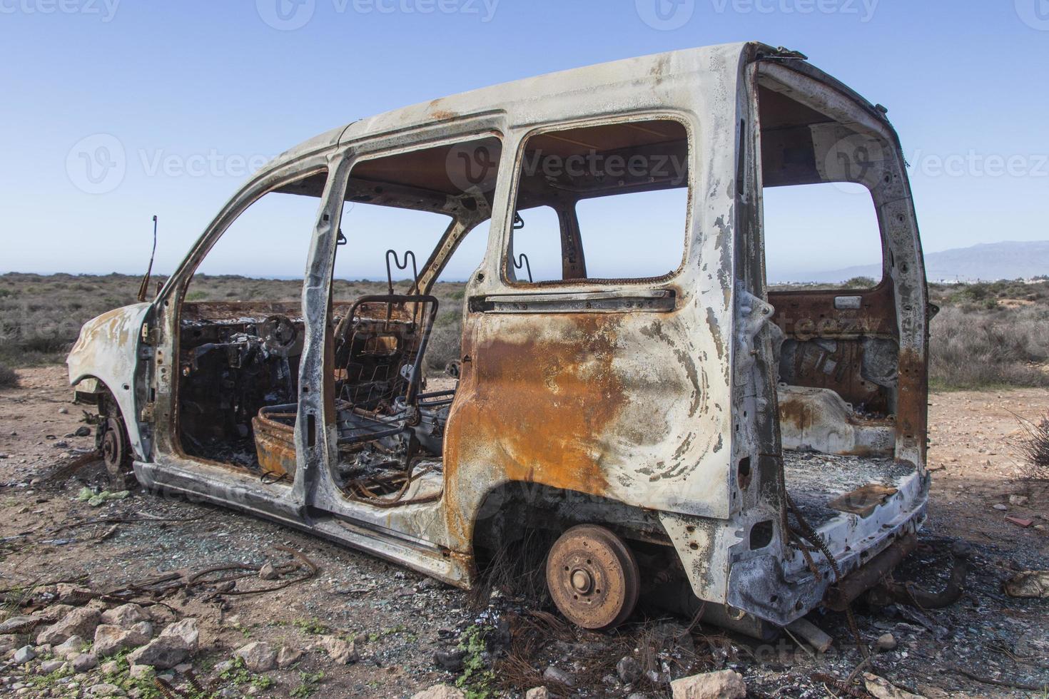 burned car abandoned, car destroyed bo fire, mini van photo