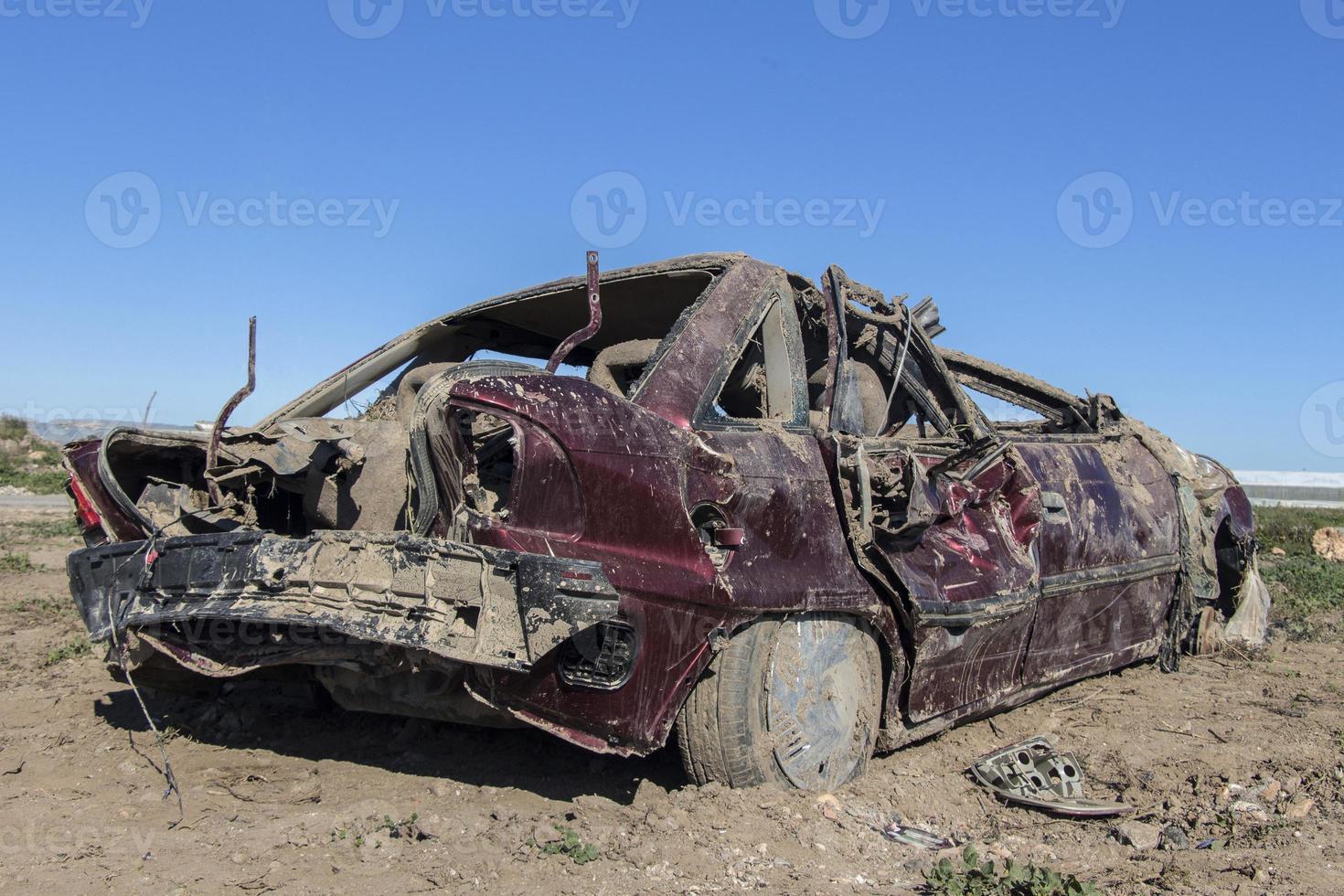 car that was destroyed in a pole after the hurricane, shattered car photo