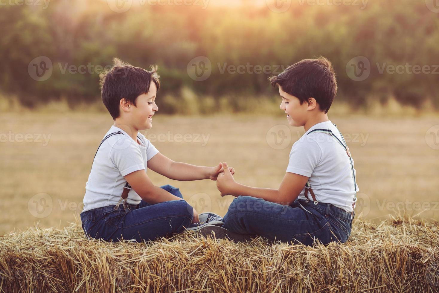 Brothers playing in the field photo