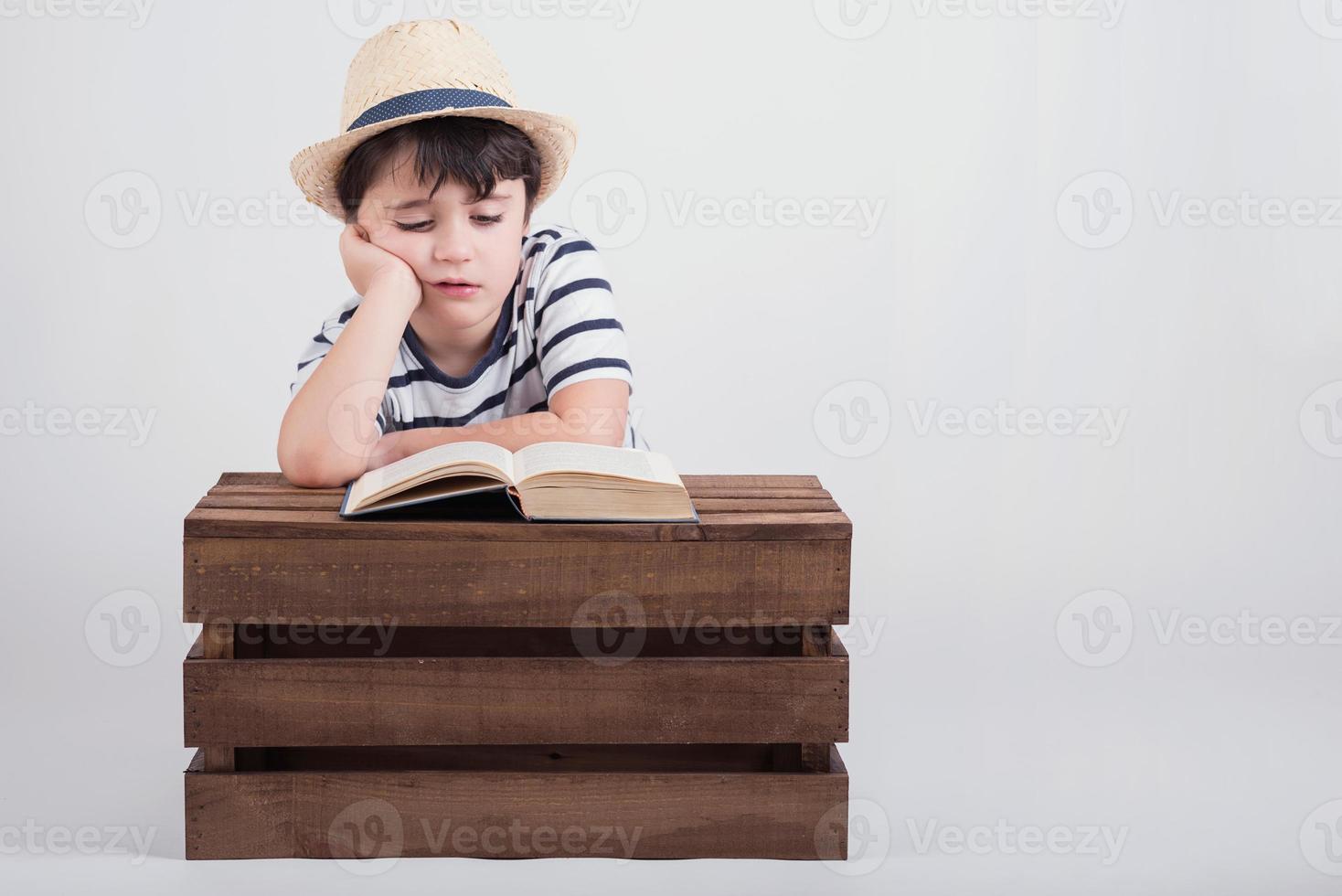 boy reading a book photo