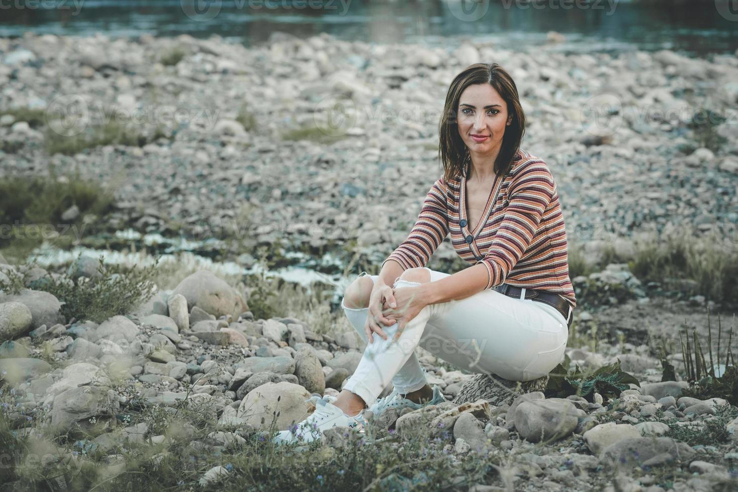 happy woman sitting on the floor photo