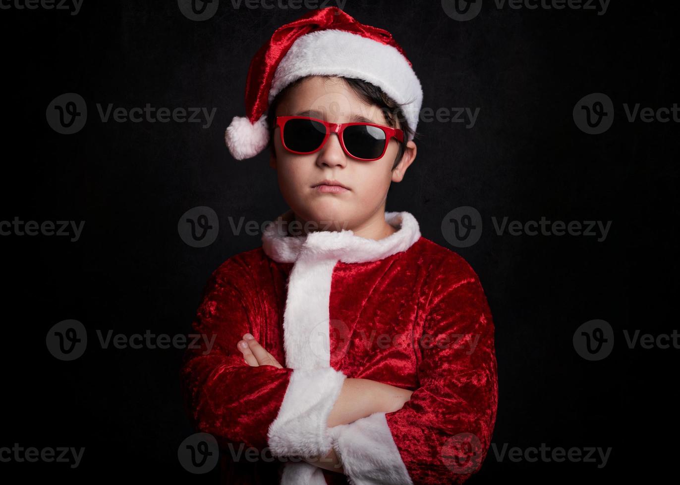 funny boy with sunglasses in christmas photo