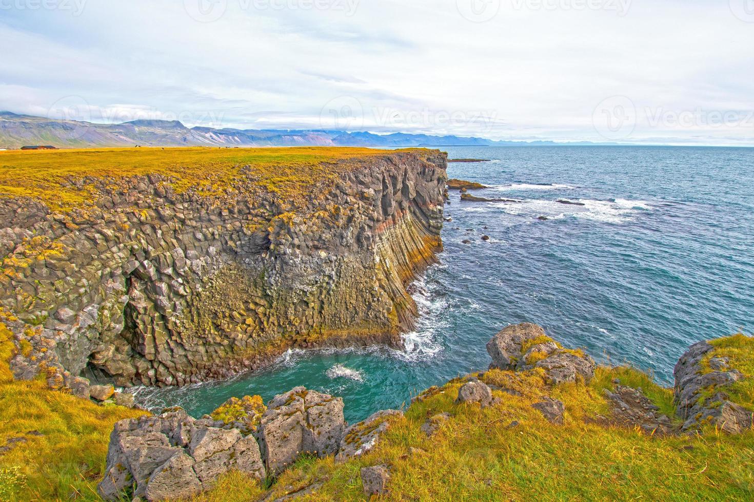Steep Cliffs on a Colorful Sea Shore photo