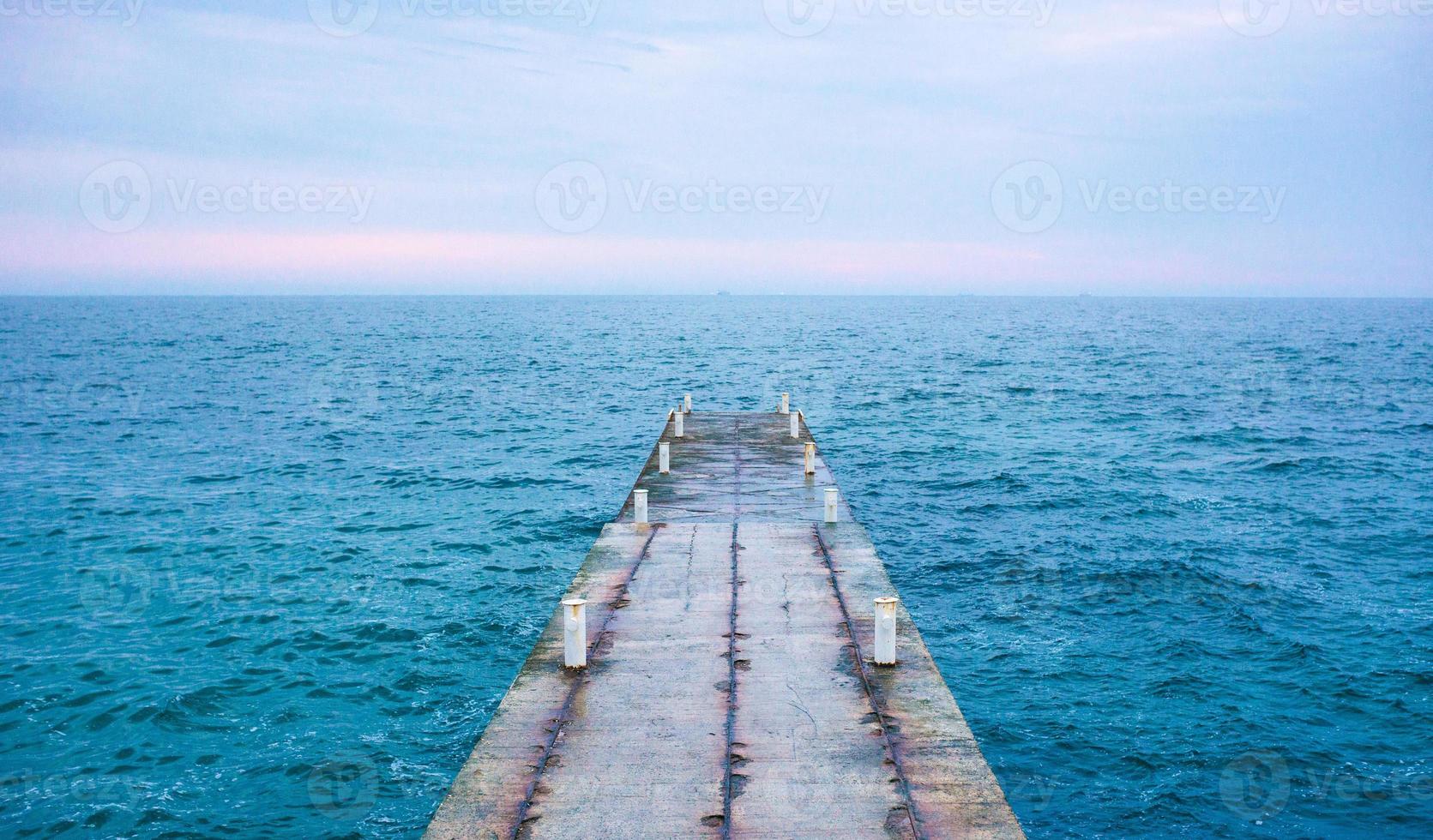 concrete pontoon in the sea photo