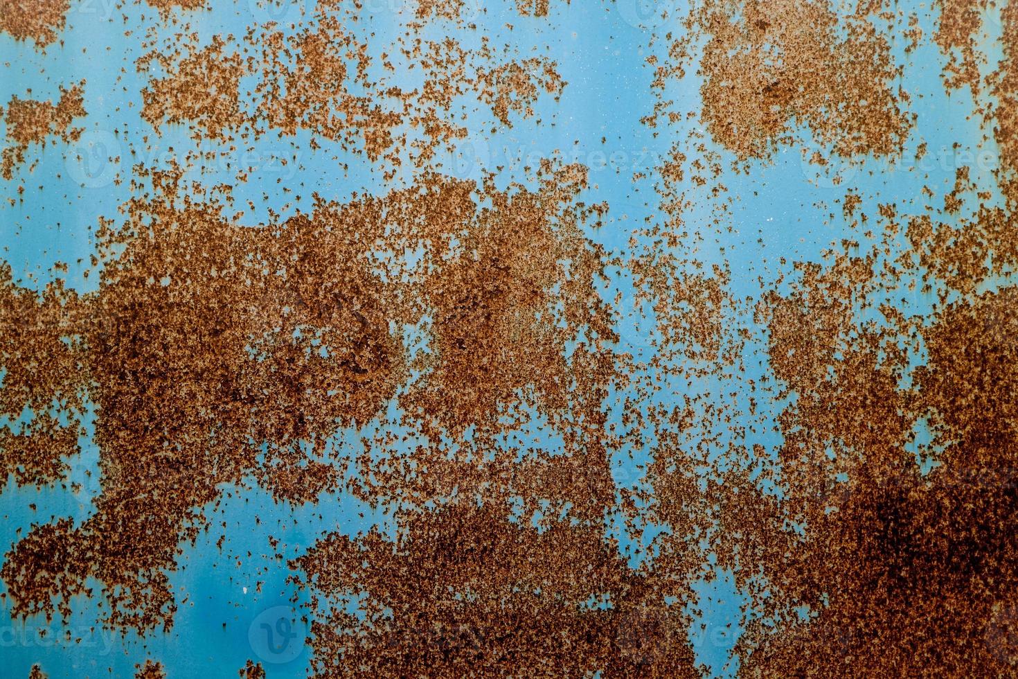 Grunge rusty metal texture. Rusted and oxidized background. photo