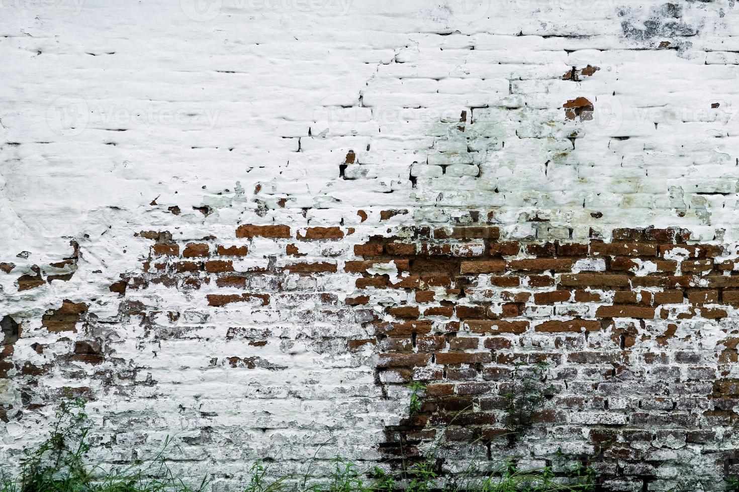 Old grunge dirty brick wall surface. Abstract tiled brick work background and pattern. photo