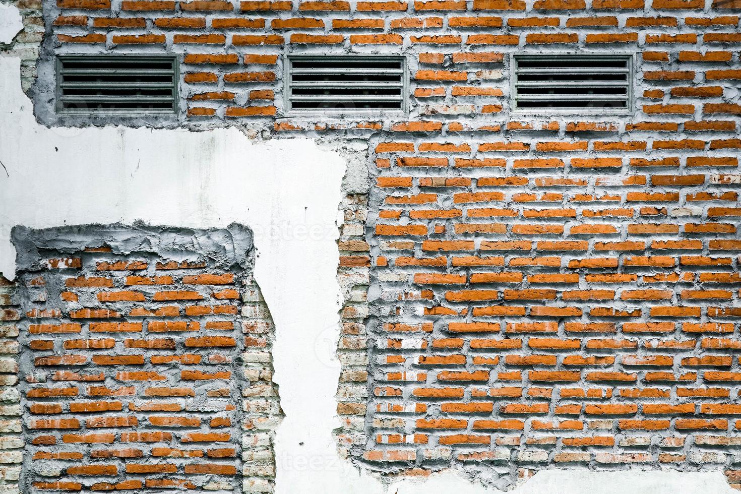 Old grunge dirty brick wall surface. Abstract tiled brick work background and pattern. photo