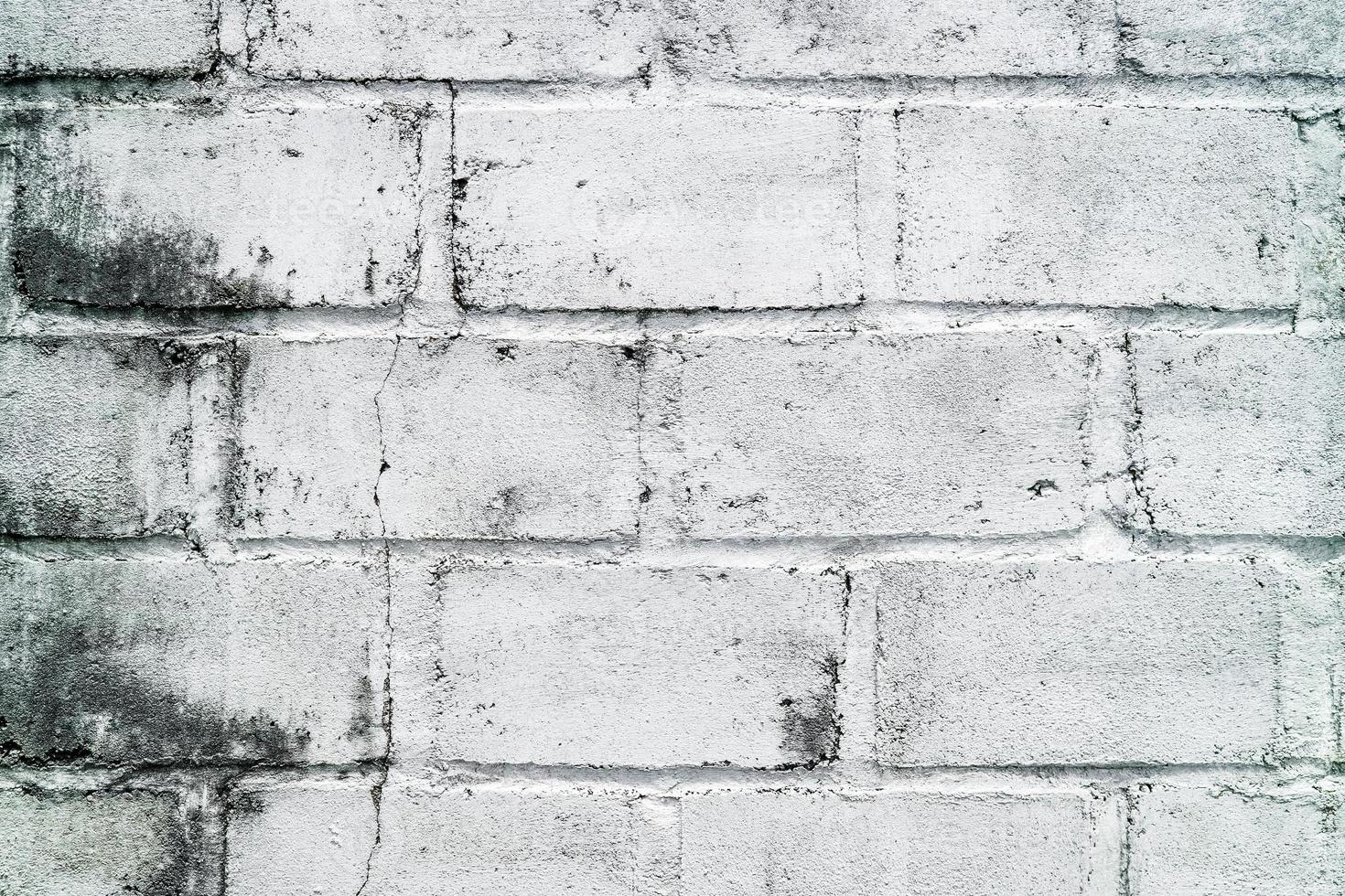 Old grunge dirty brick wall surface. Abstract tiled brick work background and pattern. photo