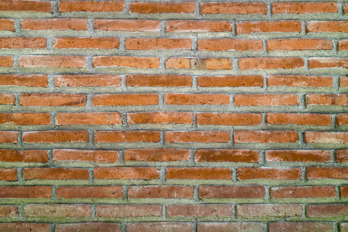 Old grunge dirty brick wall surface. Abstract tiled brick work background and pattern. photo