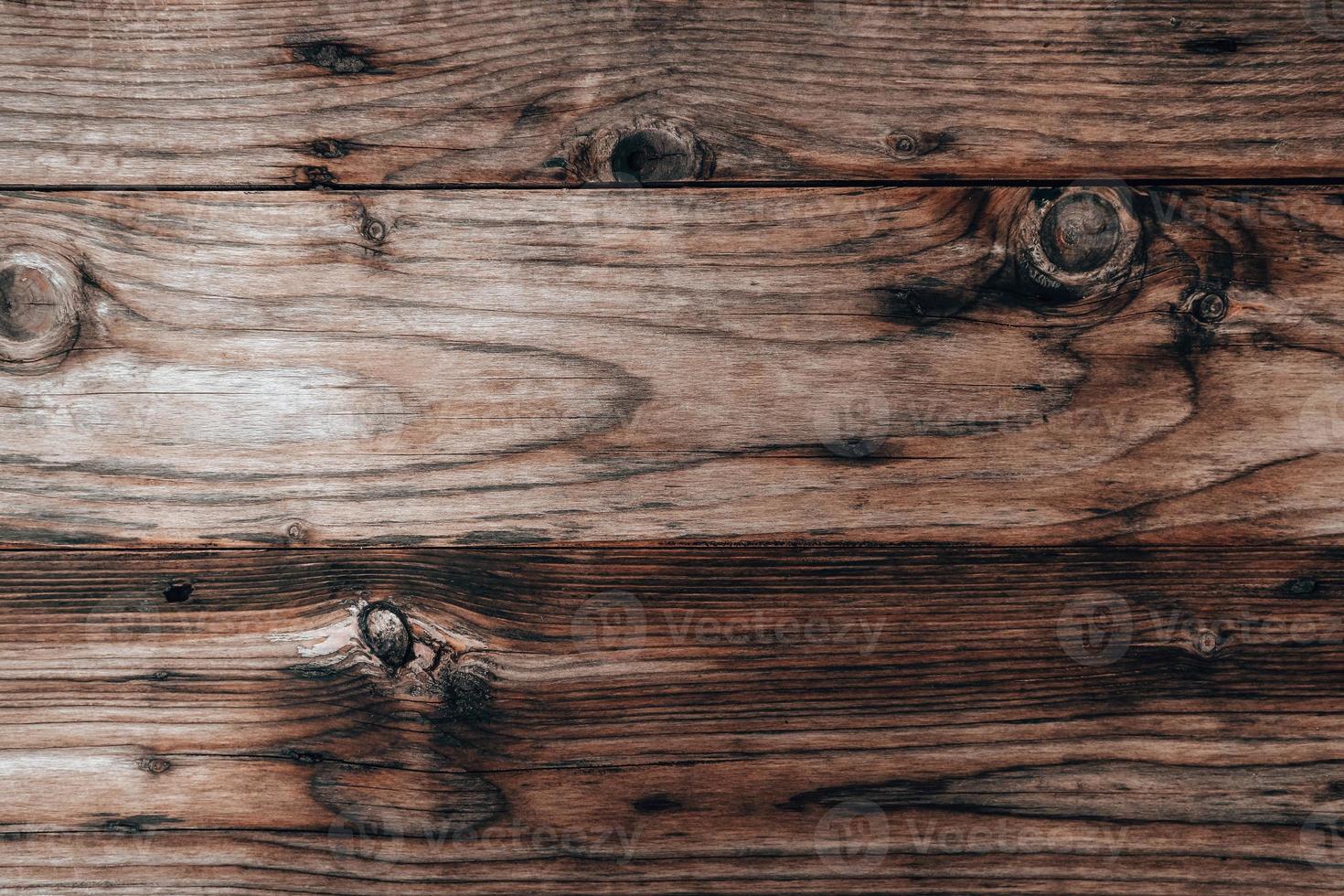 Wood texture background, weathered brown plank from barn photo