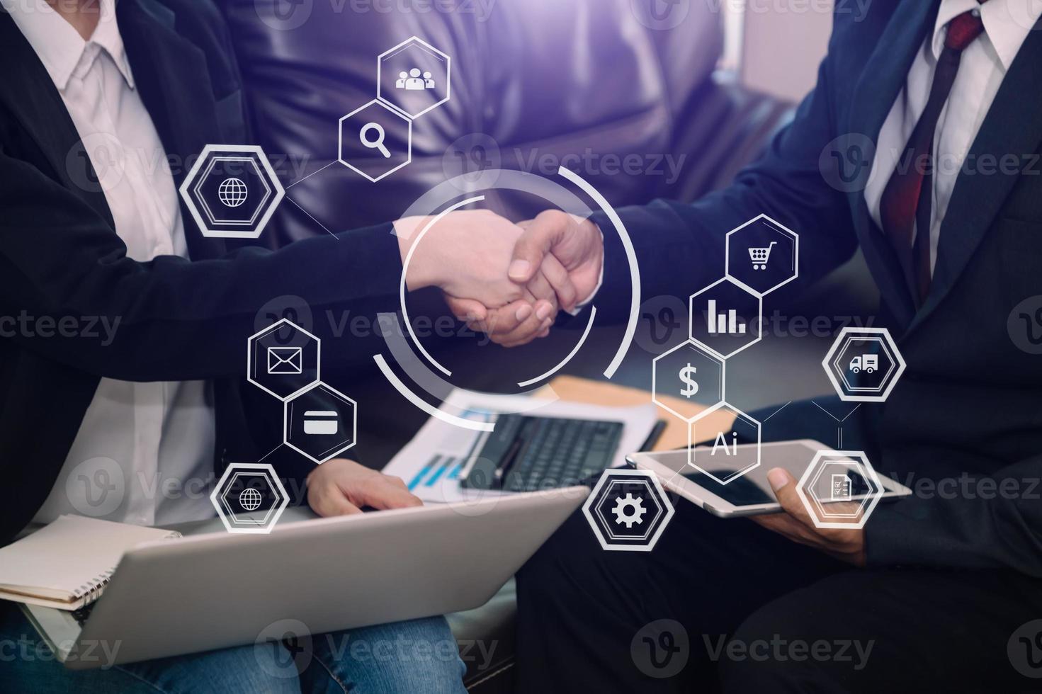 Two confident business man shaking hands during a meeting in the office, success, dealing, greeting and partner with VR icon photo