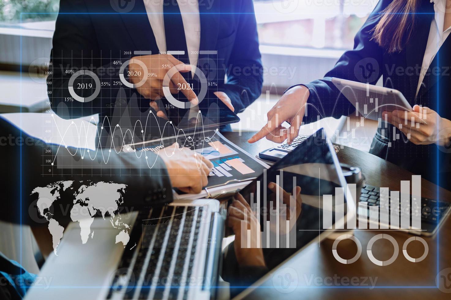 Three professional traides on technical price graph and indicator, red and green candlestick chart and stock trading computer at office photo