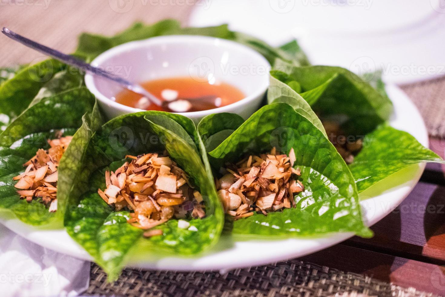 Miang kham or Savoury leaf wraps is a traditional Southeast Asian snack from Thailand 6161935